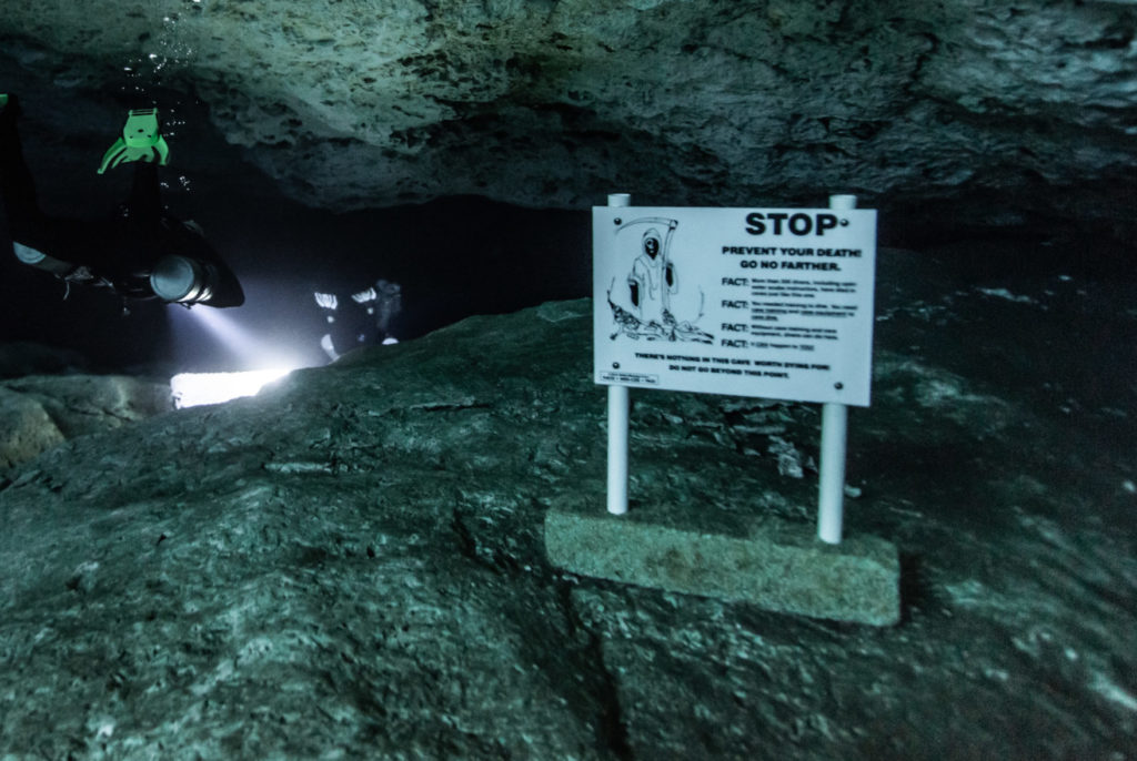 Cenote diving rules stop sign